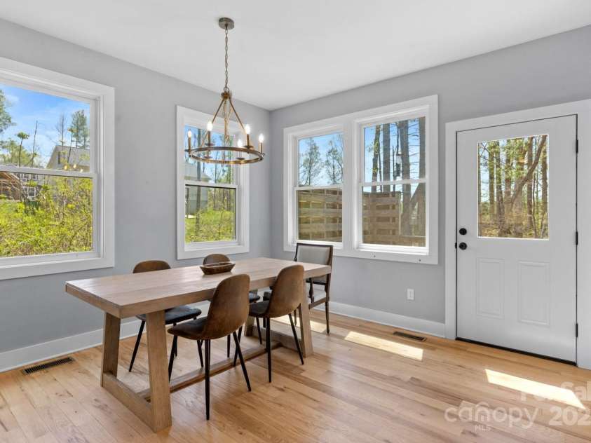 209 Fall Leaves Drive, Fairview, NC 28730.  MLS# CAR4312679, YatesRealty ID 20427. Dining area opens to back deck.