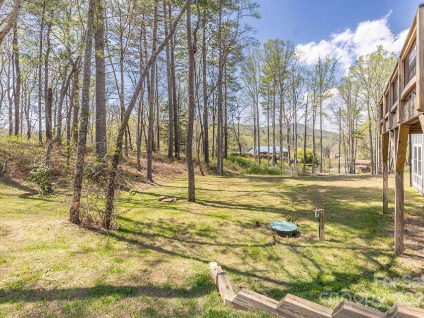 209 Fall Leaves Drive, Fairview, NC 28730.  MLS# CAR4312679, YatesRealty ID 20427. Large back yard.