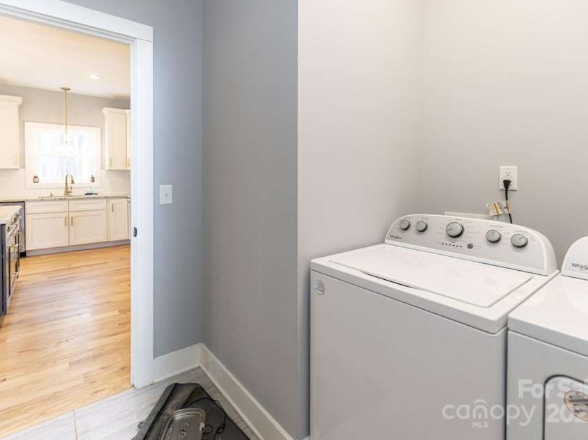 209 Fall Leaves Drive, Fairview, NC 28730.  MLS# CAR4312679, YatesRealty ID 20427. Laundry room.