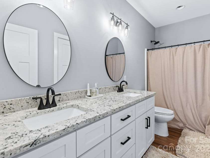 209 Fall Leaves Drive, Fairview, NC 28730.  MLS# CAR4312679, YatesRealty ID 20427. Lower level bathroom.