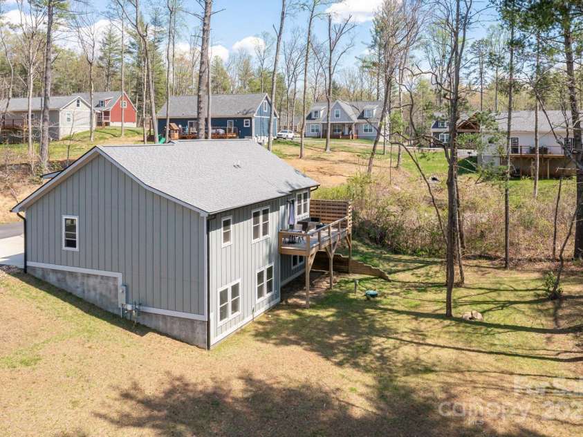 209 Fall Leaves Drive, Fairview, NC 28730.  MLS# CAR4312679, YatesRealty ID 20427. Right side of home.