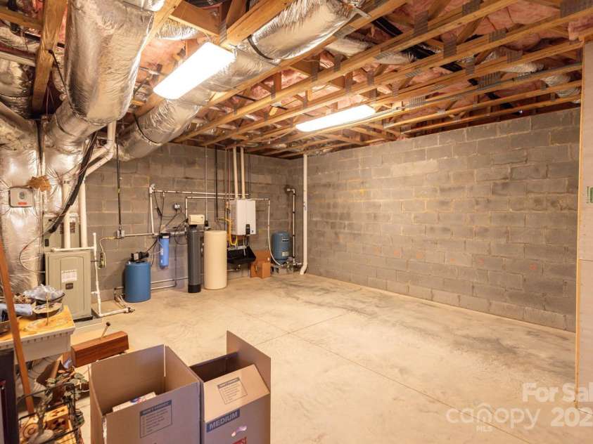 209 Fall Leaves Drive, Fairview, NC 28730.  MLS# CAR4312679, YatesRealty ID 20427. Unfinished basement.