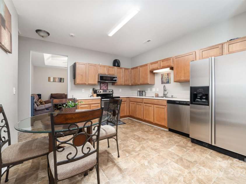 7012 Somerset Springs Drive, Charlotte, NC 28262.  MLS# CAR4267634, YatesRealty ID 20436. Kitchen with SS Appliances