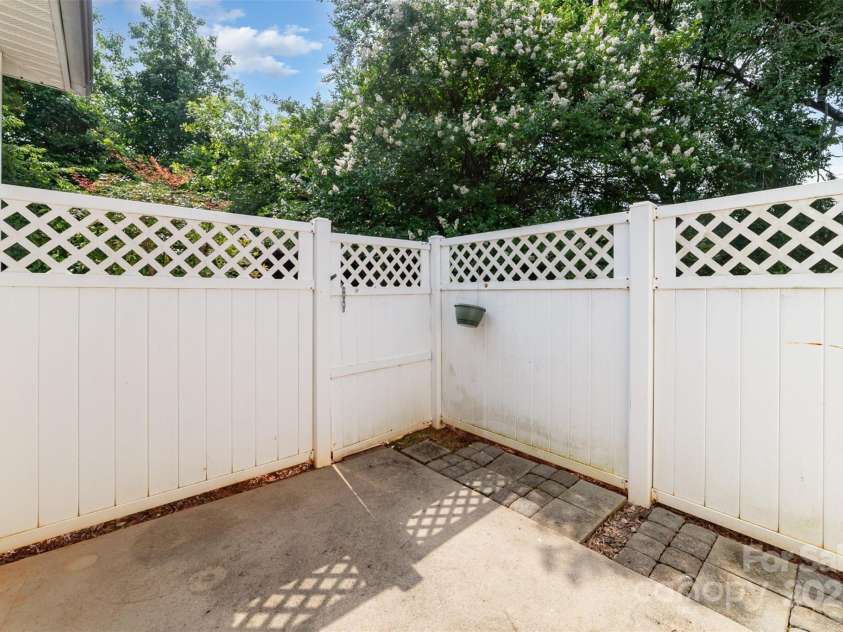 7012 Somerset Springs Drive, Charlotte, NC 28262.  MLS# CAR4267634, YatesRealty ID 20436. Private Backyard Patio