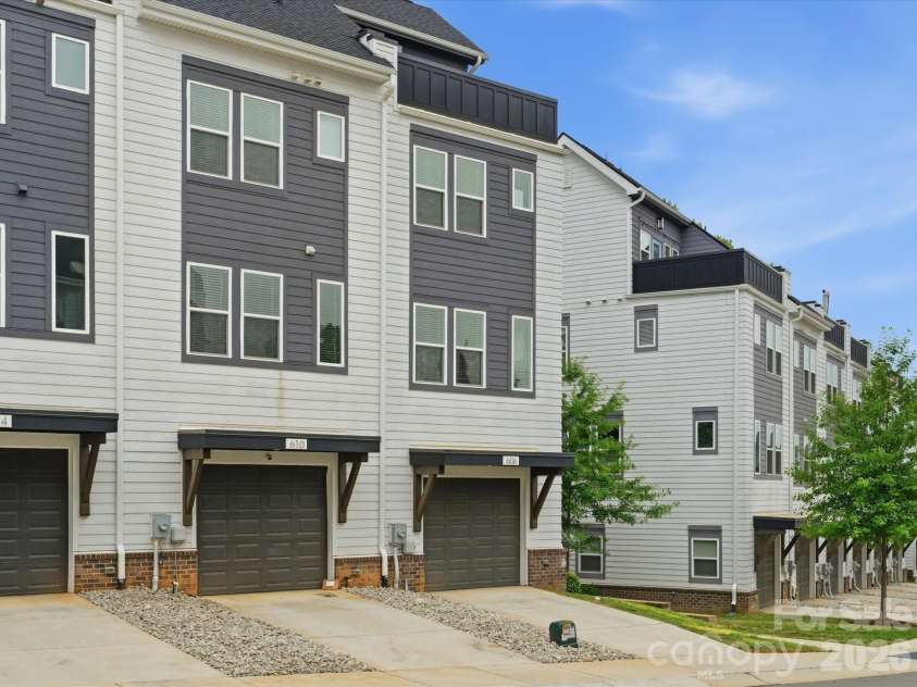 606 West End Drive, Charlotte, NC 28208.  MLS# CAR4369198, YatesRealty ID 20441. End unit two car tandem garage, directly in front when pulling into the 2nd entrance