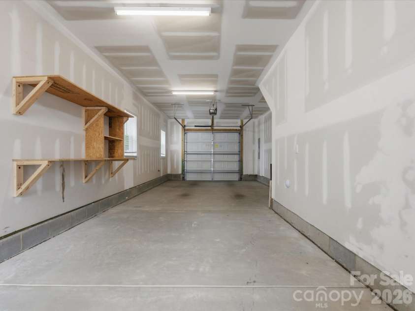 606 West End Drive, Charlotte, NC 28208.  MLS# CAR4369198, YatesRealty ID 20441. Tandem garage has ample storage