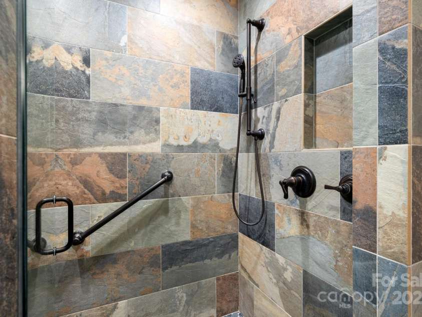 499 Warbler Lane, Black Mountain, NC 28711.  MLS# CAR4230547, YatesRealty ID 2045. Beautiful Slate tile shower