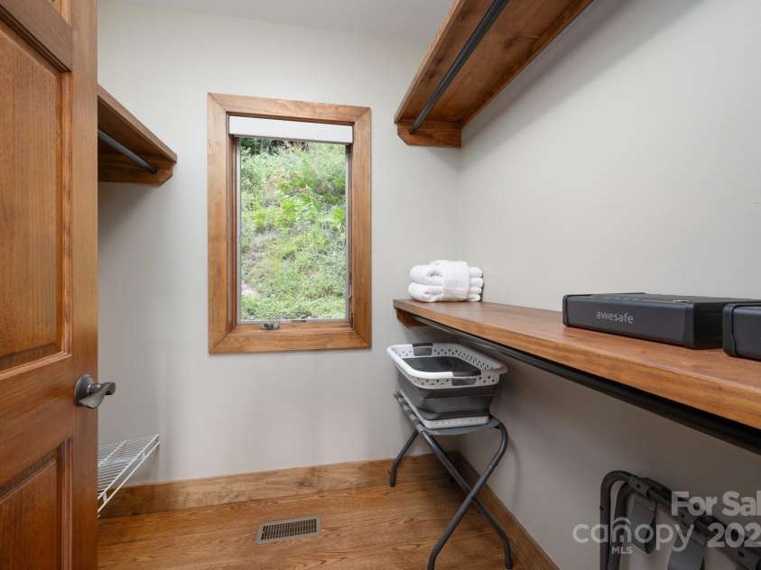 499 Warbler Lane, Black Mountain, NC 28711.  MLS# CAR4230547, YatesRealty ID 2045. Ensuite Primary Walk-in Closet