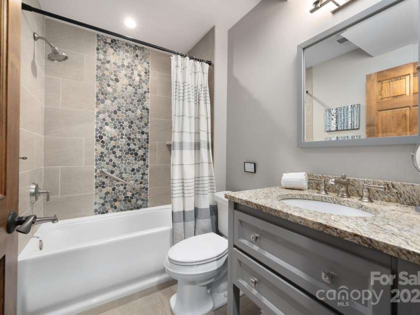 499 Warbler Lane, Black Mountain, NC 28711.  MLS# CAR4230547, YatesRealty ID 2045. Lower Level Full Bathroom