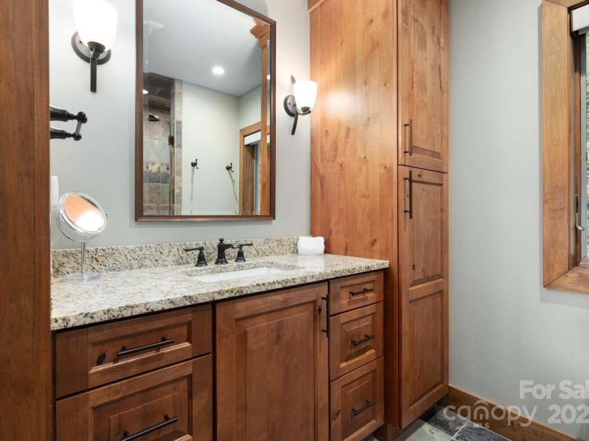 499 Warbler Lane, Black Mountain, NC 28711.  MLS# CAR4230547, YatesRealty ID 2045. Primary Ensuite Bathroom with Custom Cabinetry