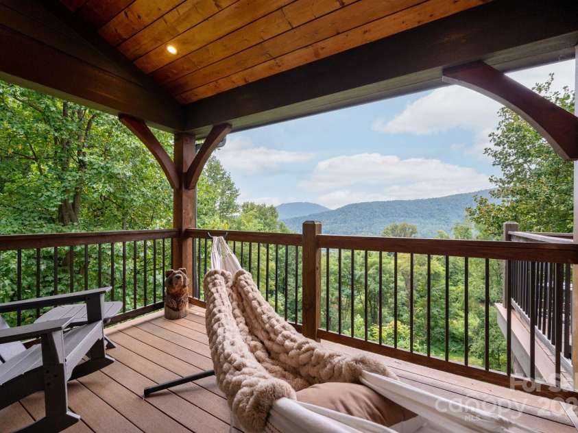 499 Warbler Lane, Black Mountain, NC 28711.  MLS# CAR4230547, YatesRealty ID 2045. Private Covered Balcony off Primary Suite