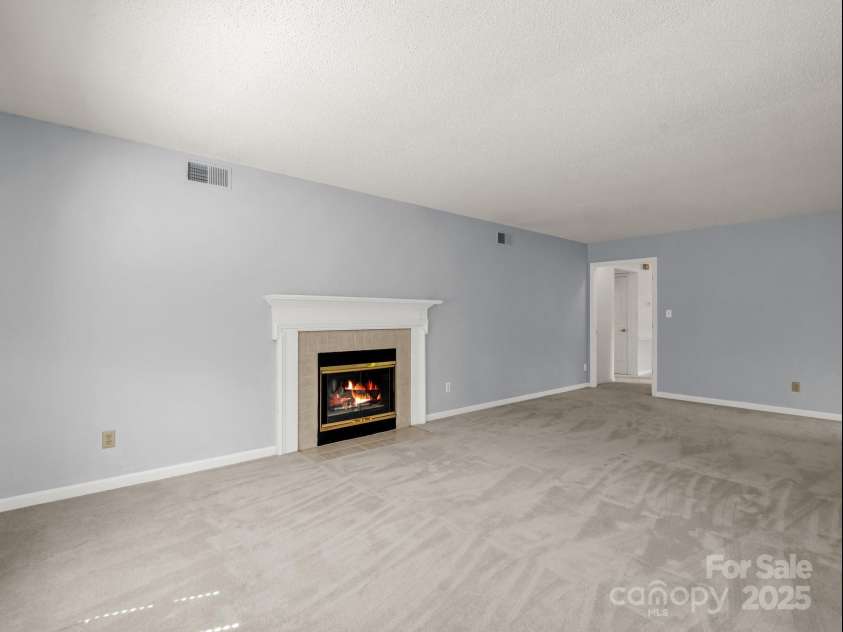 3101 Saint Augustine Place, Asheville, NC 28805.  MLS# CAR4260431, YatesRealty ID 20455. Enjoy the gas fireplace on cool nights.
