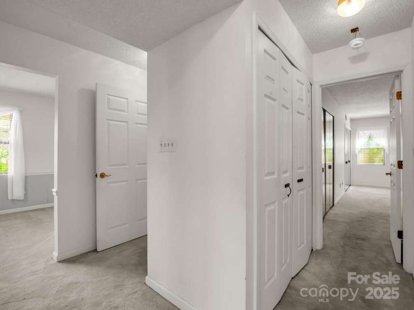 3101 Saint Augustine Place, Asheville, NC 28805.  MLS# CAR4260431, YatesRealty ID 20455. Hallway off Dining Room to Bedrooms and Laundry Closet