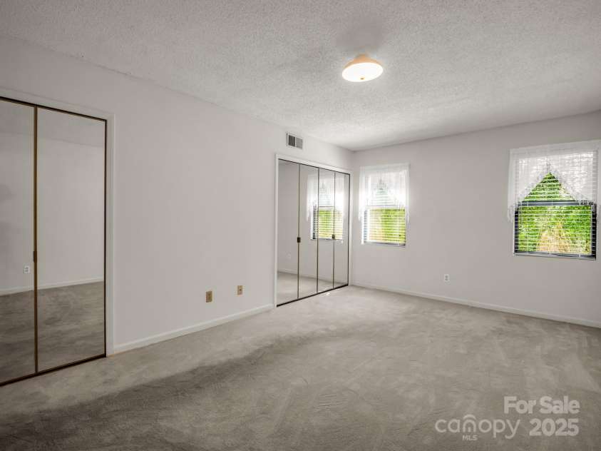 3101 Saint Augustine Place, Asheville, NC 28805.  MLS# CAR4260431, YatesRealty ID 20455. Two closets in primary bedroom.