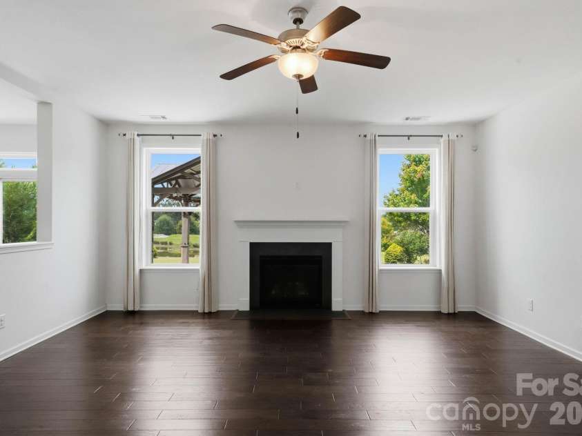 108 Heron Cove Loop, Mooresville, NC 28117.  MLS# CAR4427585, YatesRealty ID 20457. Family Room Overlooking Backyard