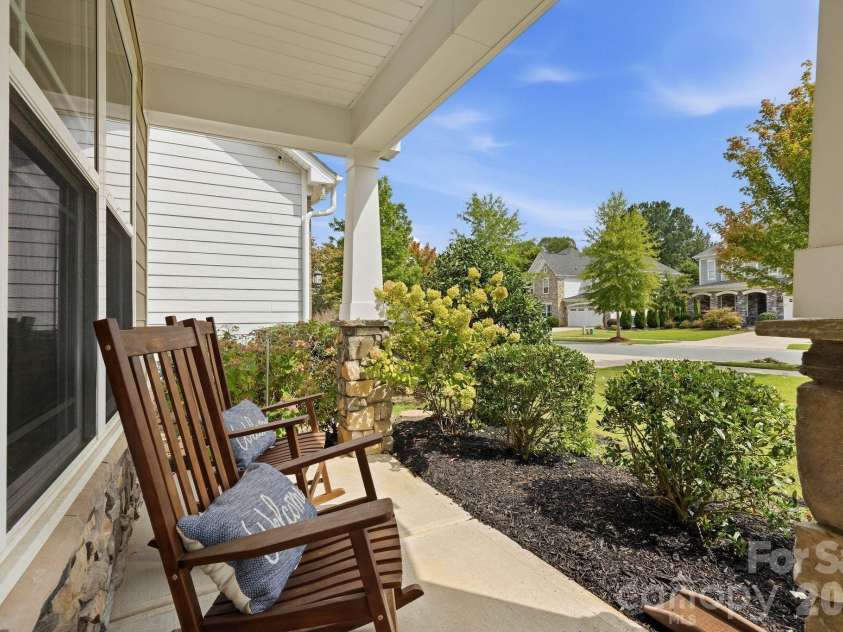 108 Heron Cove Loop, Mooresville, NC 28117.  MLS# CAR4427585, YatesRealty ID 20457. Relax on Rocking Chair Front Porch