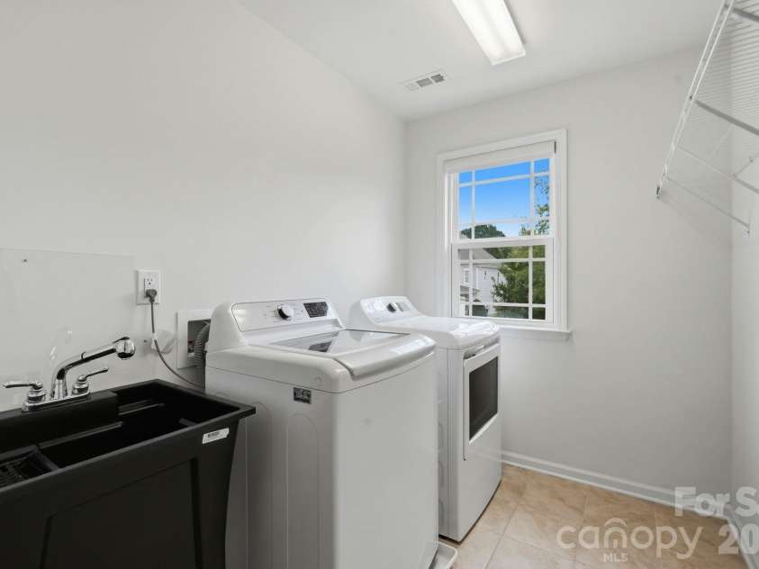 108 Heron Cove Loop, Mooresville, NC 28117.  MLS# CAR4427585, YatesRealty ID 20457. Upper Level Laundry Room with utility sink