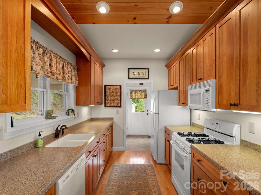 88 Brown Bear Way, Waynesville, NC 28786.  MLS# CAR4307371, YatesRealty ID 2046. Kitchen flows into Laundry/Mud Room