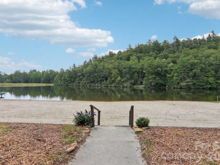 1063 Swiss Pine Lake Drive, Spruce Pine, NC 28777.  MLS# CAR4366630, YatesRealty ID 20477. Access to community beach!