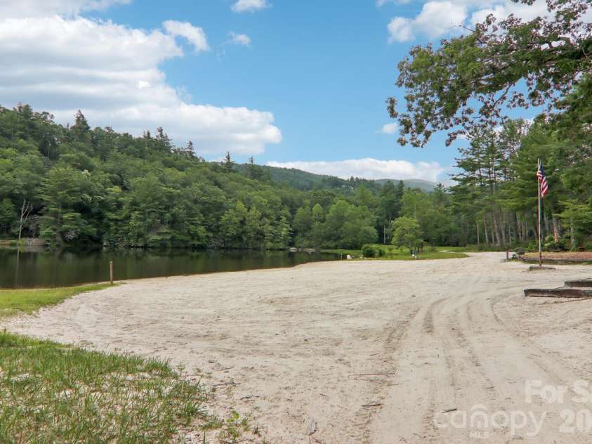 1063 Swiss Pine Lake Drive, Spruce Pine, NC 28777.  MLS# CAR4366630, YatesRealty ID 20477. Expansive beach with mountain views
