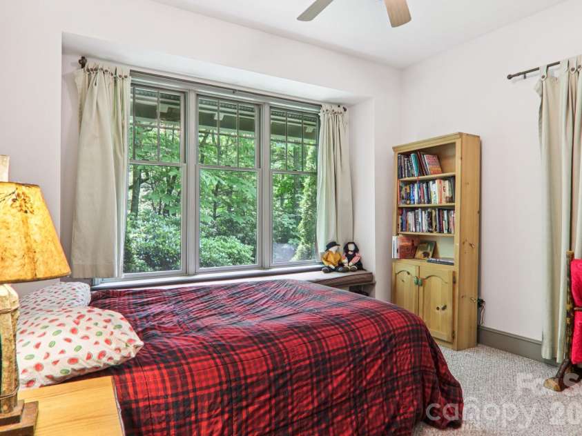 1063 Swiss Pine Lake Drive, Spruce Pine, NC 28777.  MLS# CAR4366630, YatesRealty ID 20477. Second bedroom with custom window storage bench