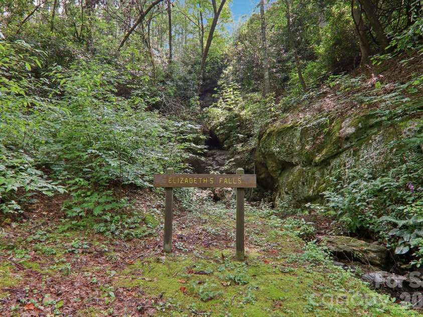 1063 Swiss Pine Lake Drive, Spruce Pine, NC 28777.  MLS# CAR4366630, YatesRealty ID 20477. Waterfall in the community
