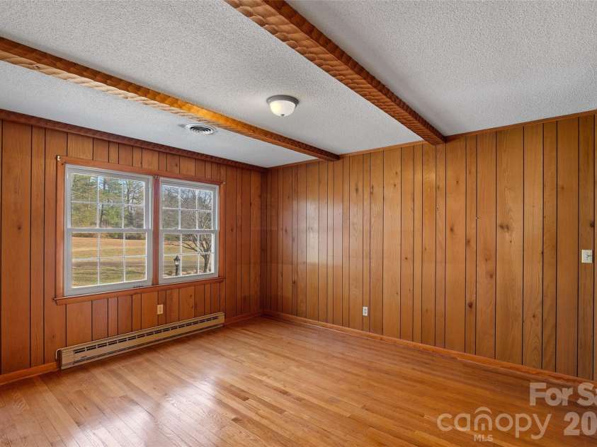 591 Landrum Road, Columbus, NC 28722.  MLS# CAR4337351, YatesRealty ID 20484. Bedroom 2 has beamed ceiling