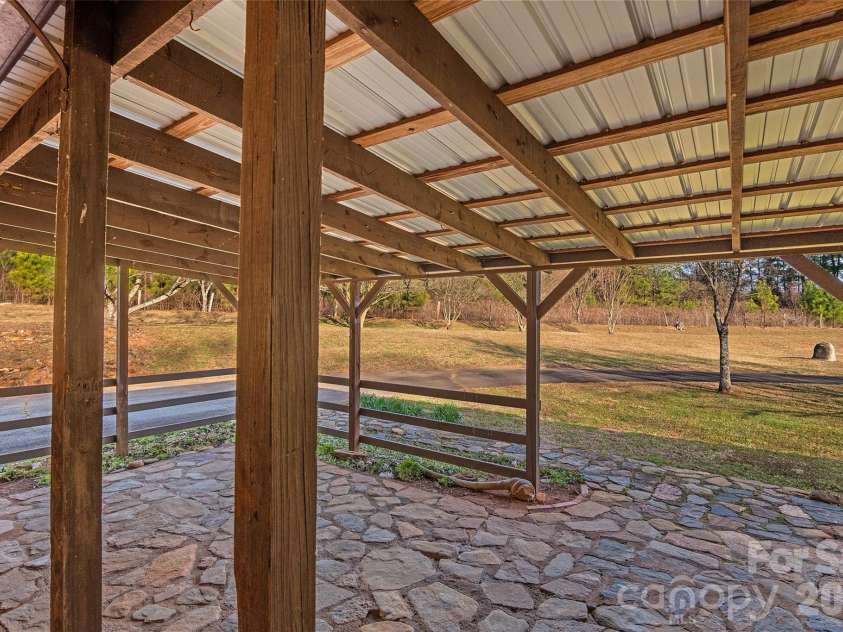 591 Landrum Road, Columbus, NC 28722.  MLS# CAR4337351, YatesRealty ID 20484. Covered rear patio.