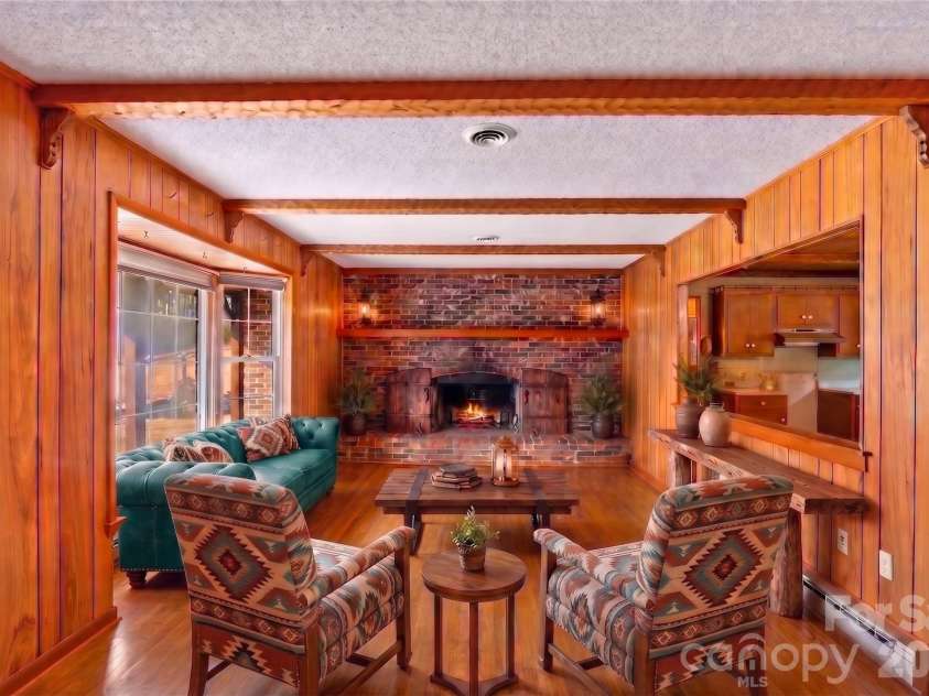 591 Landrum Road, Columbus, NC 28722.  MLS# CAR4337351, YatesRealty ID 20484. VIRTUALLY STAGED LIVING ROOM