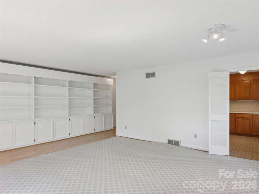 927 Ladson Road, Mills River, NC 28759.  MLS# CAR4370799, YatesRealty ID 20487. Apartment den accesses the kitchen