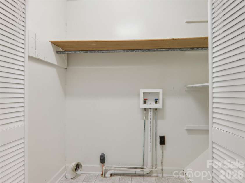 927 Ladson Road, Mills River, NC 28759.  MLS# CAR4370799, YatesRealty ID 20487. Apartment laundry