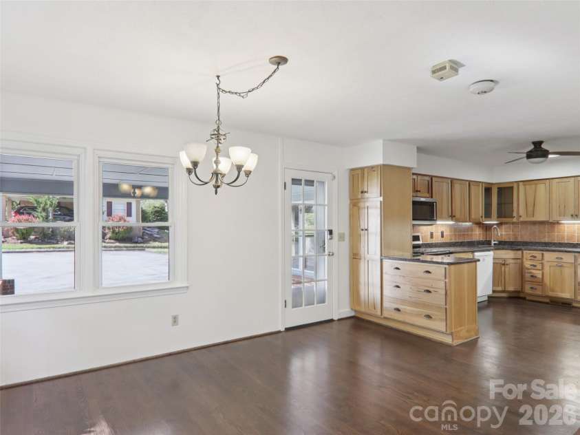 927 Ladson Road, Mills River, NC 28759.  MLS# CAR4370799, YatesRealty ID 20487. Kitchen flows to dining area