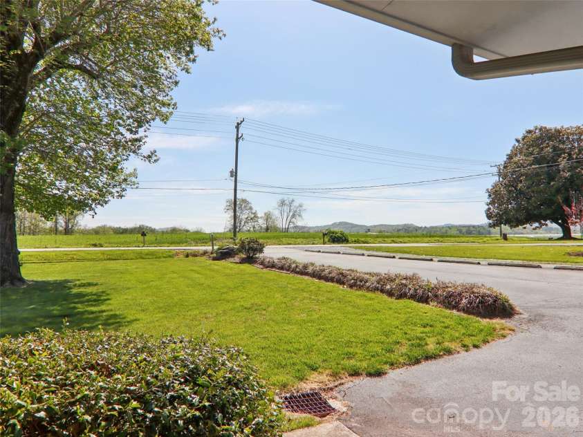 927 Ladson Road, Mills River, NC 28759.  MLS# CAR4370799, YatesRealty ID 20487. View from front porch and driveway with additional parking