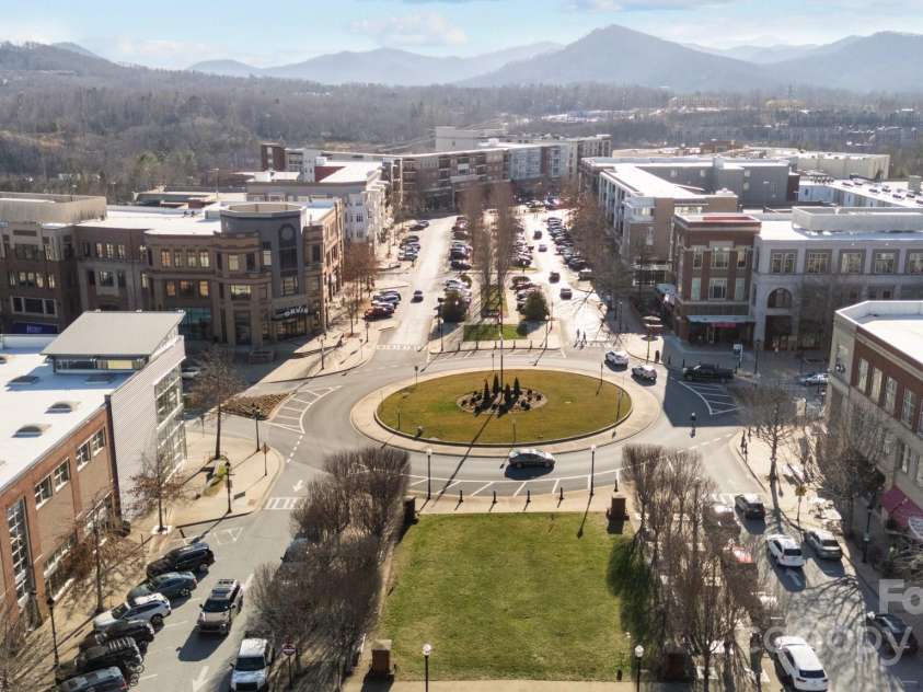 1011 Columbine Road, Asheville, NC 28803.  MLS# CAR4231603, YatesRealty ID 2049. Biltmore Park Town Square with shopping, dining, exercise, and entertainment options is walking distance!