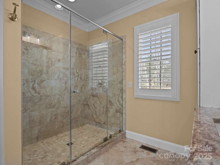 1011 Columbine Road, Asheville, NC 28803.  MLS# CAR4231603, YatesRealty ID 2049. Primary en-suite also features a glass-enclosed walk-in shower