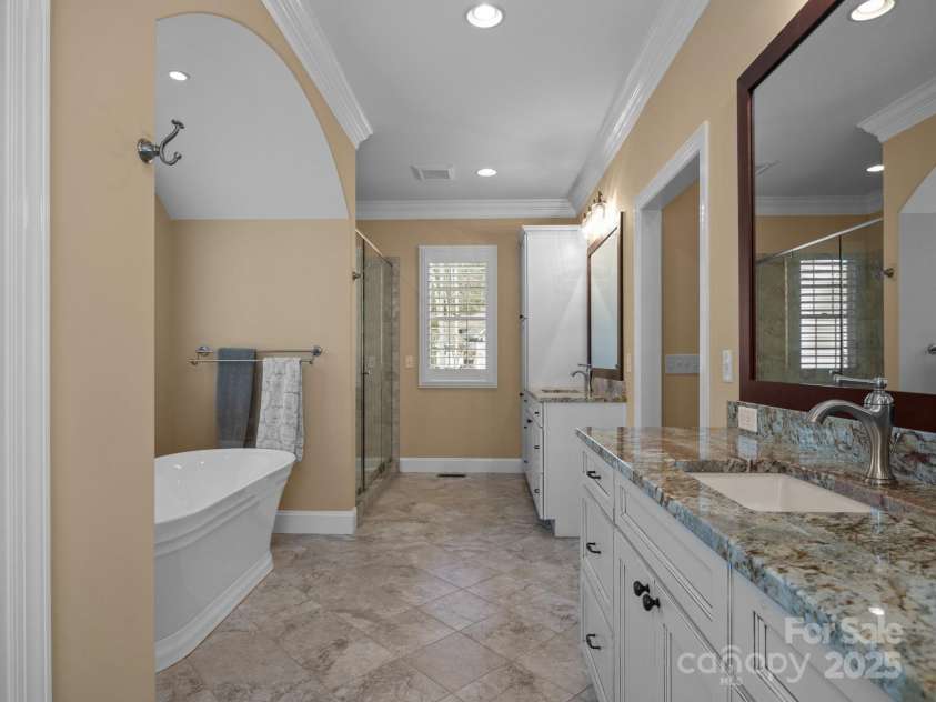 1011 Columbine Road, Asheville, NC 28803.  MLS# CAR4231603, YatesRealty ID 2049. You'll look forward to getting ready every morning in the spacious and luxurious primary bathroom!
