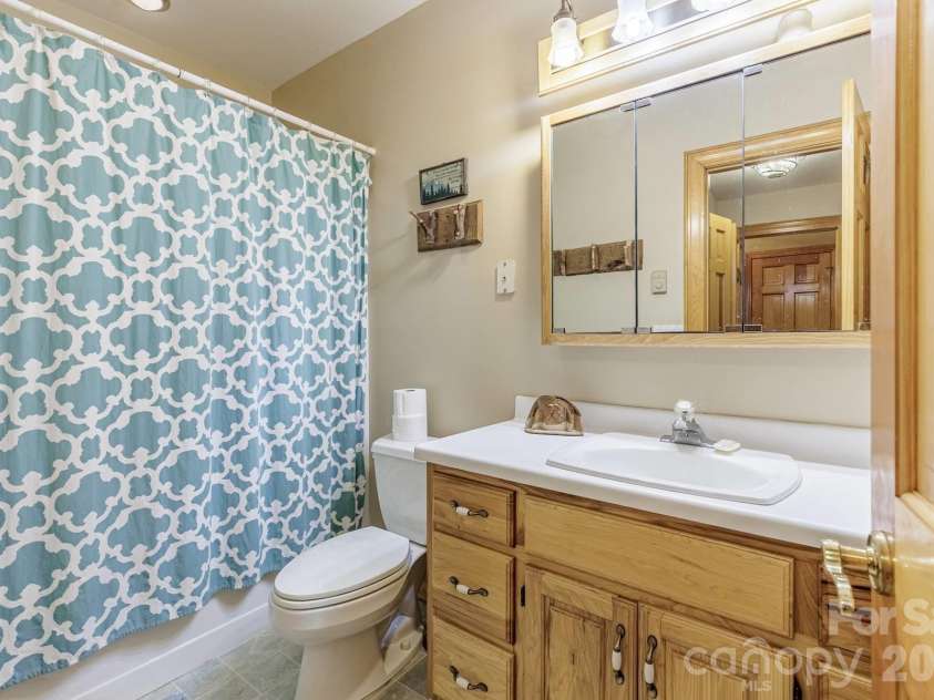 97 Covered Bridge Road, Stecoah, NC 98771.  MLS# CAR4377921, YatesRealty ID 20498. Downstairs Bathroom