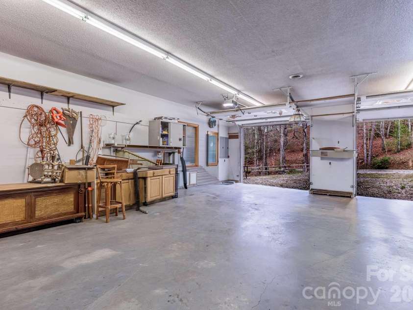 97 Covered Bridge Road, Stecoah, NC 98771.  MLS# CAR4377921, YatesRealty ID 20498. Edited by AI