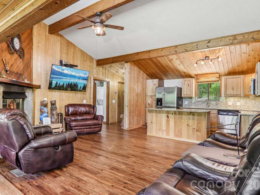 348 Valley Creek Drive, Maggie Valley, NC 28751.  MLS# CAR4372209, YatesRealty ID 20500. Great room towards kitchen