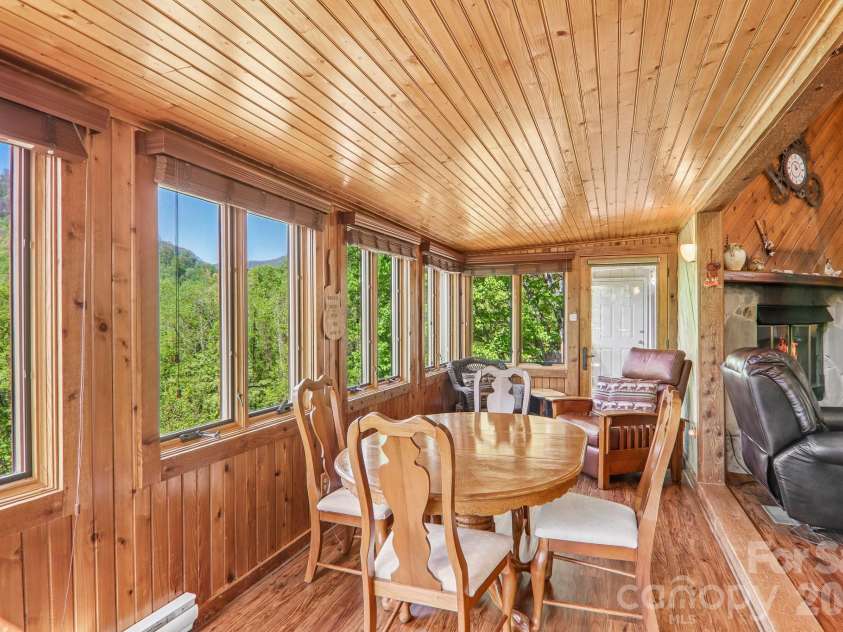 348 Valley Creek Drive, Maggie Valley, NC 28751.  MLS# CAR4372209, YatesRealty ID 20500. Sun room - seating area
