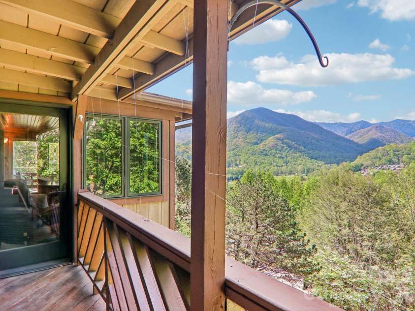 348 Valley Creek Drive, Maggie Valley, NC 28751.  MLS# CAR4372209, YatesRealty ID 20500. SUNSET VIEWS ON covered porch 