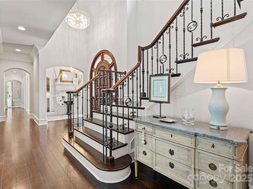 8500 Longview Club Drive, Waxhaw, NC 28173.  MLS# CAR4268585, YatesRealty ID 20500. The beautiful main staircase to take you up to the second floor