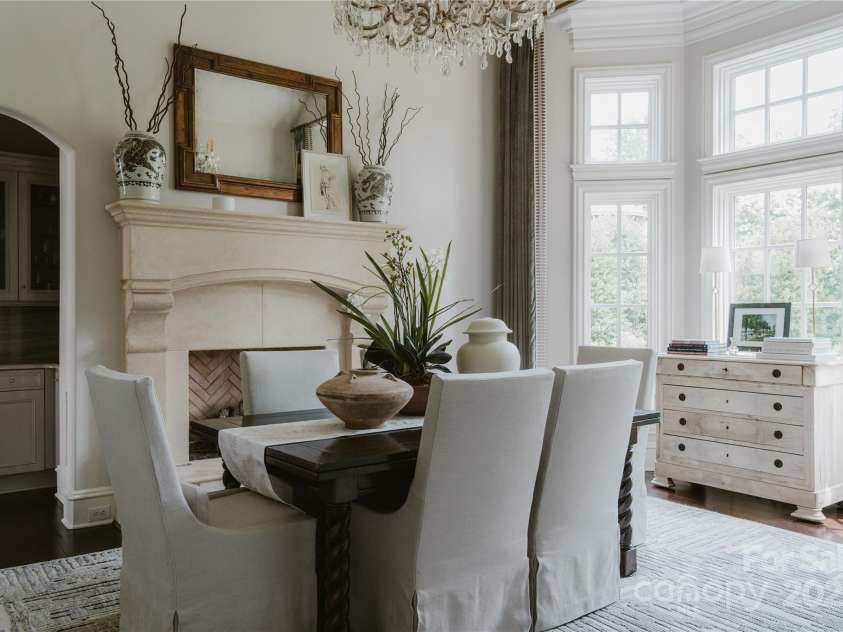 8500 Longview Club Drive, Waxhaw, NC 28173.  MLS# CAR4268585, YatesRealty ID 20500. The formal dining room is anchored by a beautiful limestone fireplace