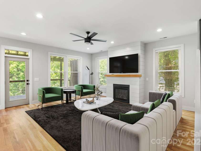 83 Talmadge Street, Asheville, NC 28806.  MLS# CAR4269008, YatesRealty ID 20511. Living room with gas fireplace