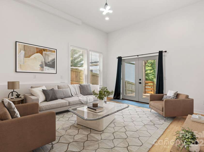 83 Talmadge Street, Asheville, NC 28806.  MLS# CAR4269008, YatesRealty ID 20511. Lower level family room  - virtually staged