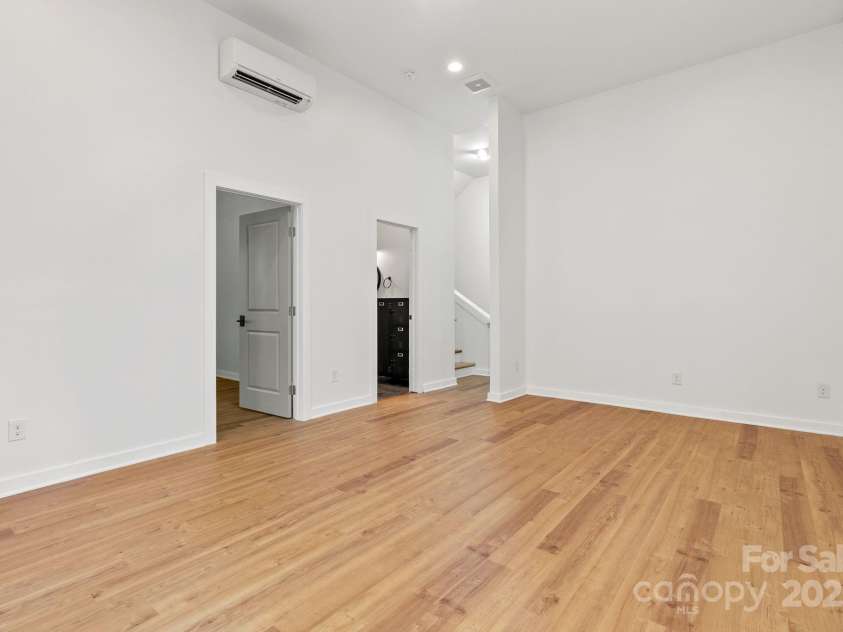 83 Talmadge Street, Asheville, NC 28806.  MLS# CAR4269008, YatesRealty ID 20511. Lower level family room with mini split