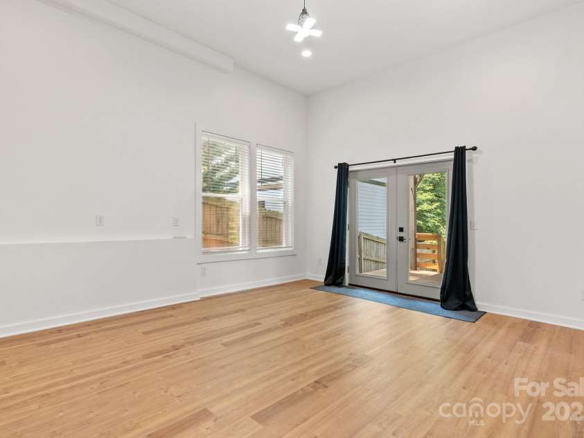 83 Talmadge Street, Asheville, NC 28806.  MLS# CAR4269008, YatesRealty ID 20511. Lower level family room with outside entrance -potential second living quarters?