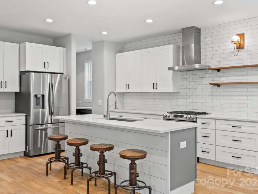 83 Talmadge Street, Asheville, NC 28806.  MLS# CAR4269008, YatesRealty ID 20511. Stainless appliances, granite counter tops and subway tile backsplash