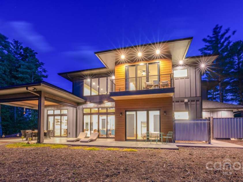 223 Linville View Drive, Nebo, NC 28761.  MLS# CAR4258430, YatesRealty ID 20516. Twilight rear view from lake