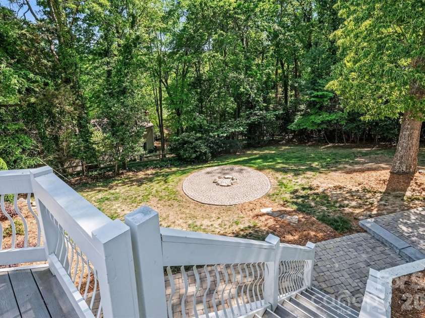 7010 Terrace Drive, Charlotte, NC 28211.  MLS# CAR4358839, YatesRealty ID 20519. Firepit ready for logs